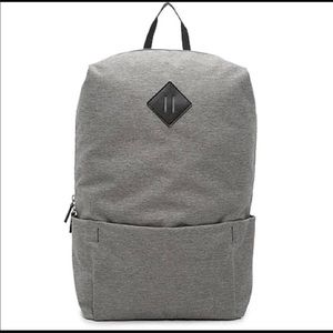Grey Backpack with black detail and zip closure